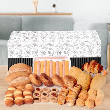 Cesta de café da manhã com pães e doces